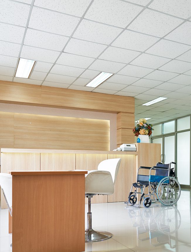 Bright medical reception area with empty wheelchair
