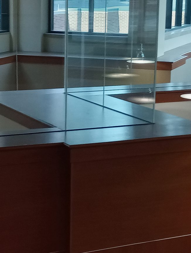 Empty office reception desk with glass partitions