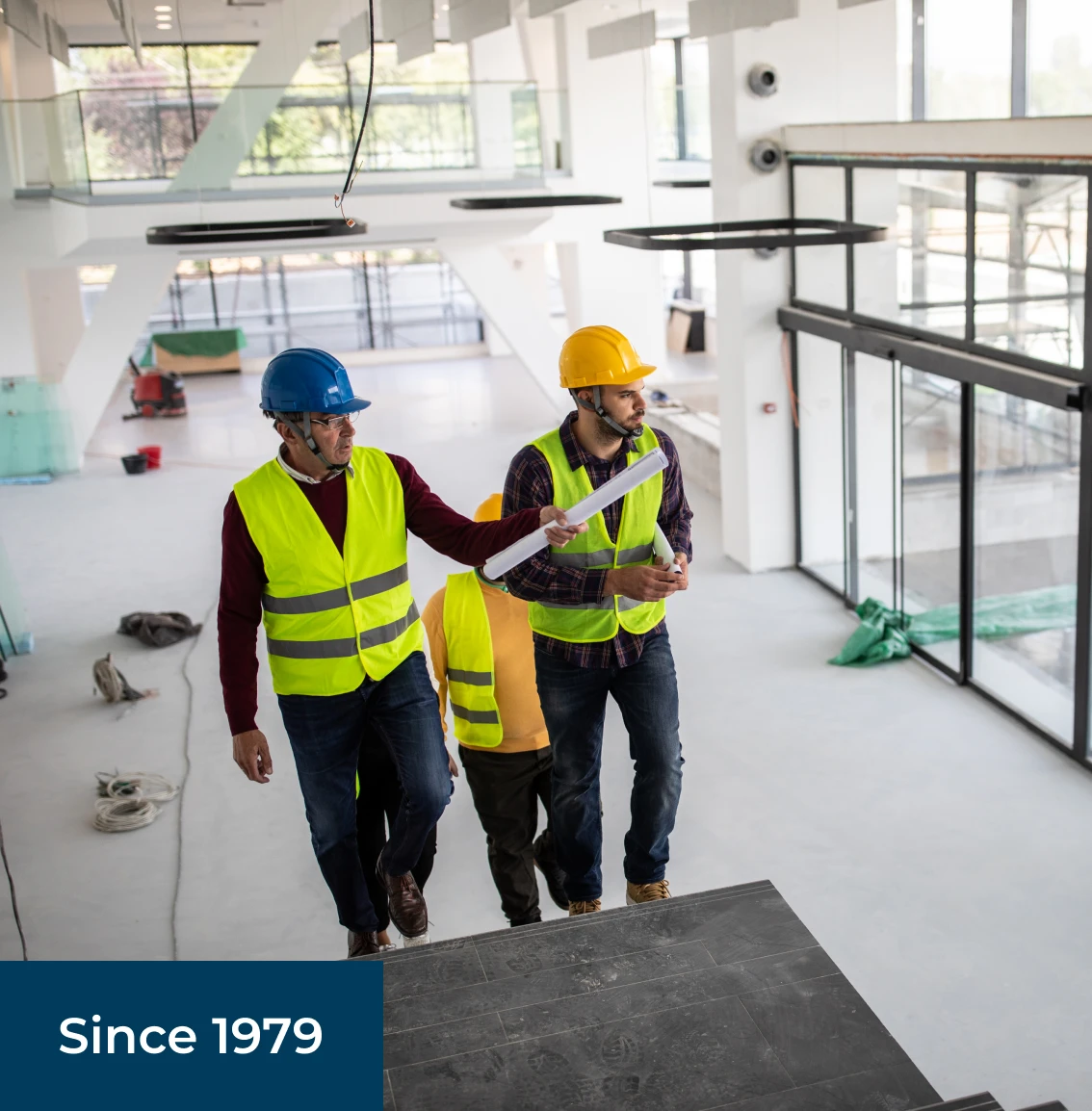 Workers inspecting modern construction site