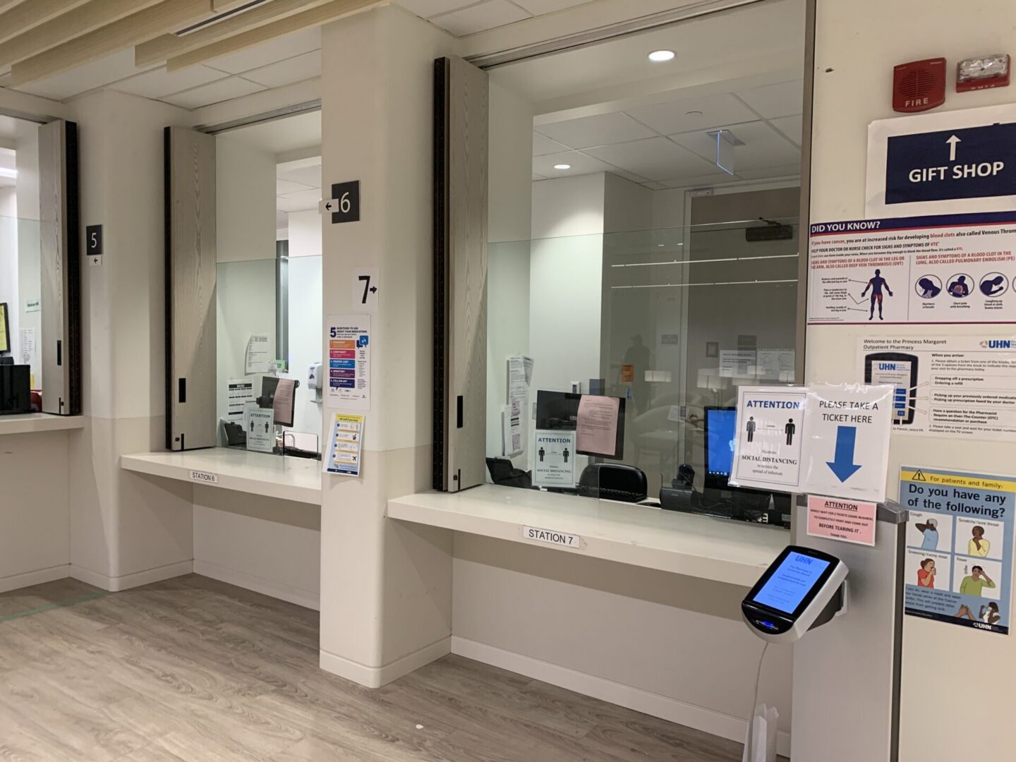 Hospital reception windows with check-in kiosk